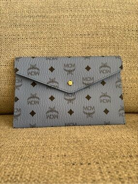 MCM Powder Blue Logo Envelope Wristlet with Brown Accents
